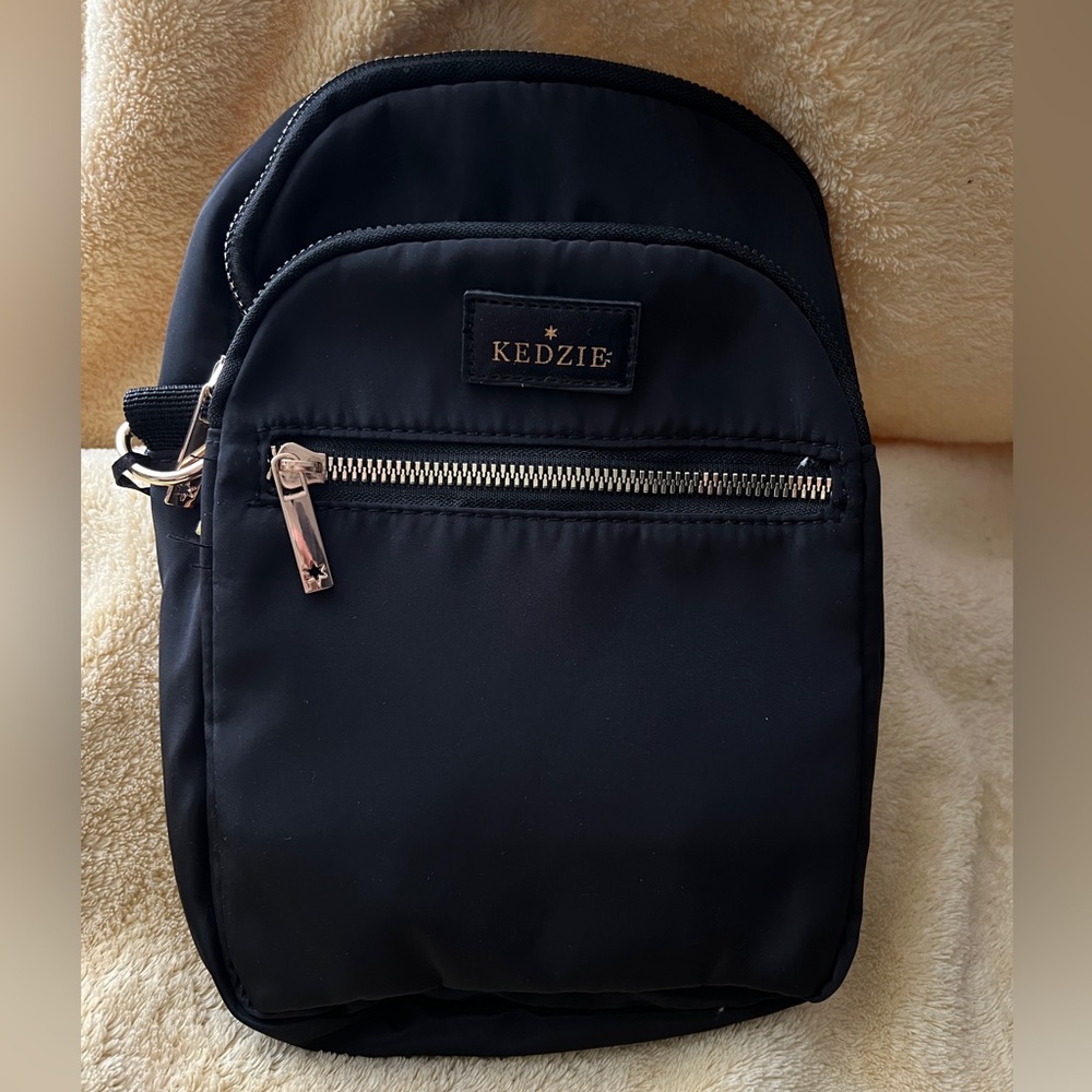 Kenzie Roundtrip Convertible Sling purse backpack, Black, new with tags